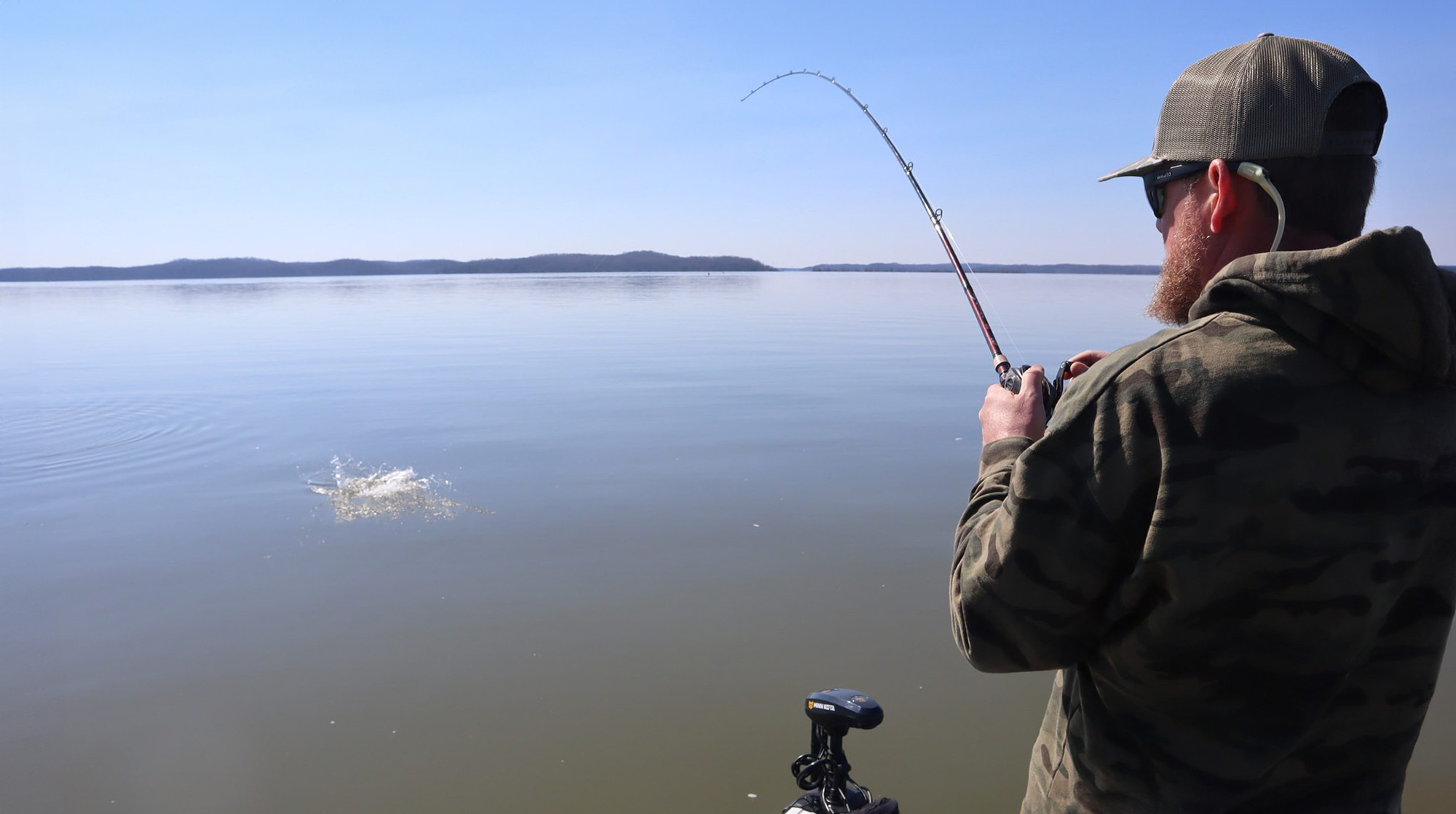 Man fishing in a boat on a lake